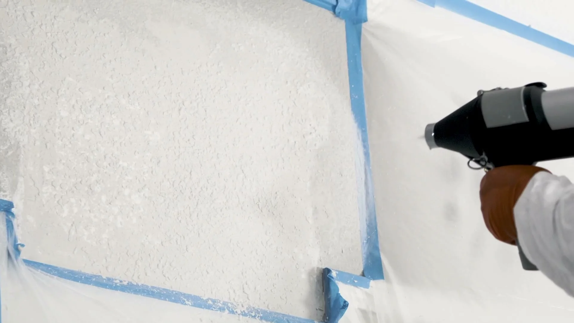 Fresh texture on a patched wall, before the knife and before paint.